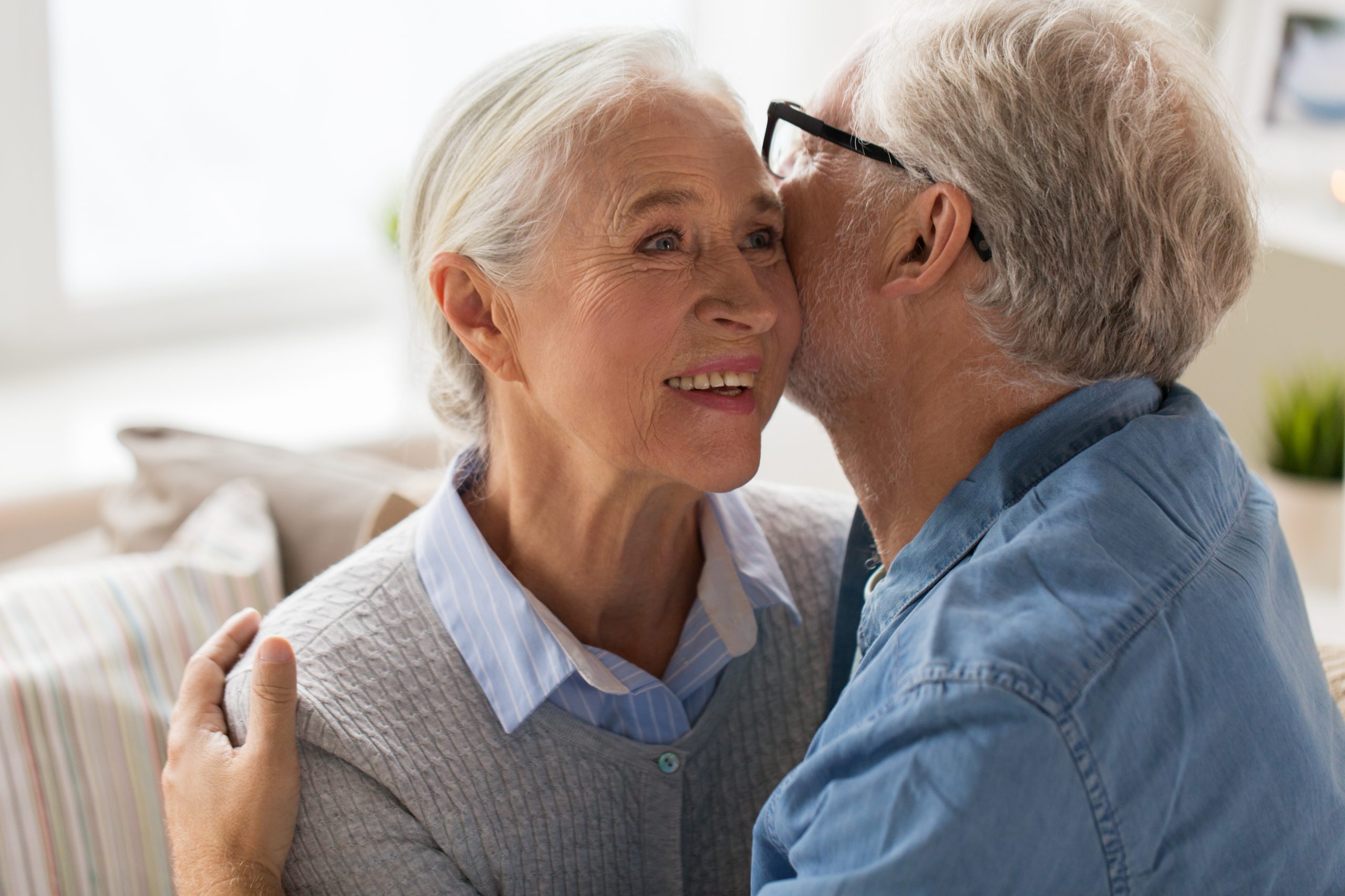 Senior couple hugging and smiling together