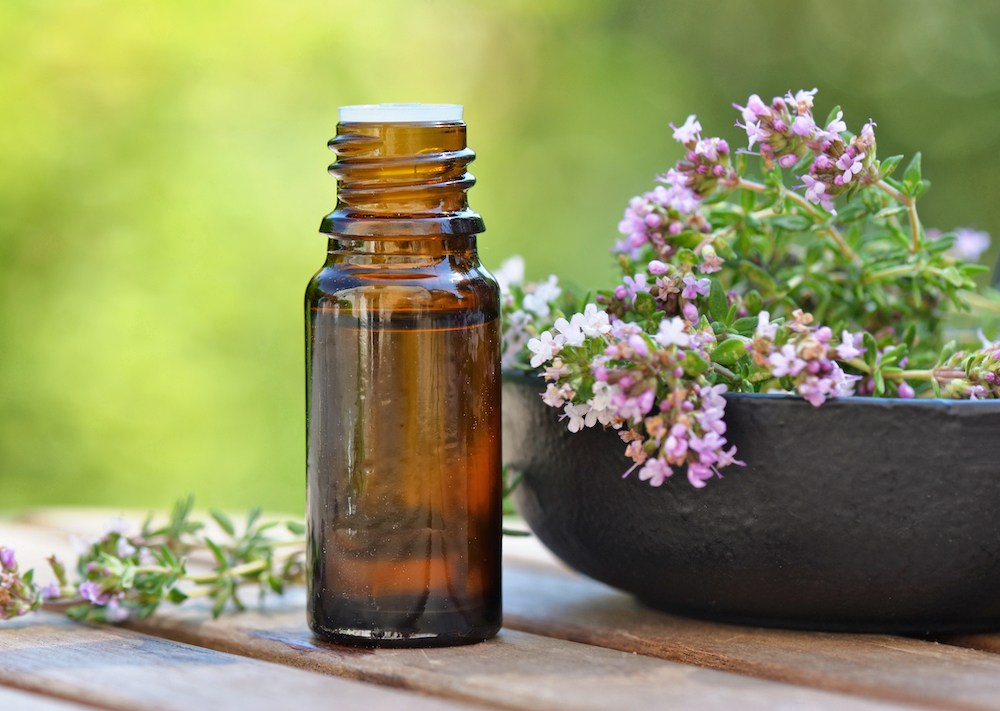 A bottle of essential oils with lavender