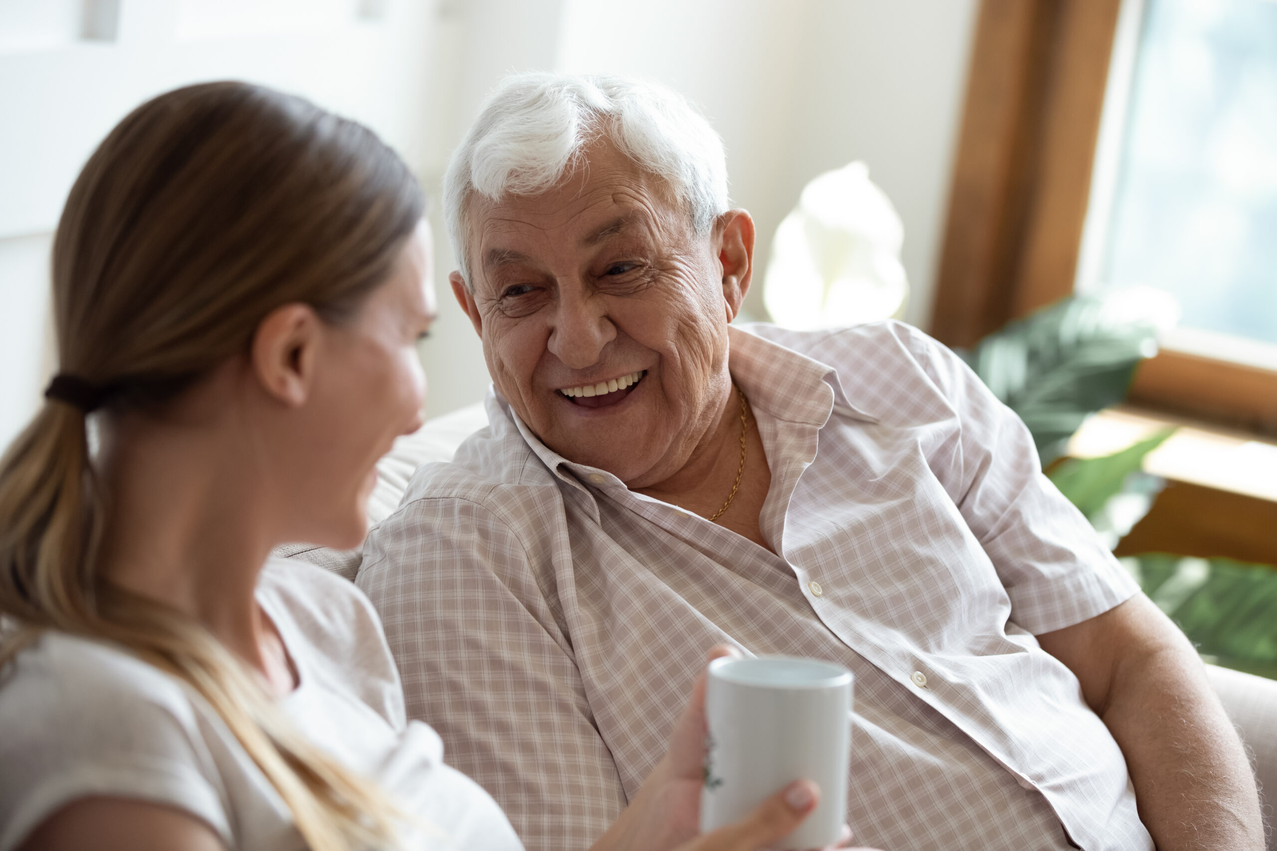 Caregiver assisting elderly daily tasks