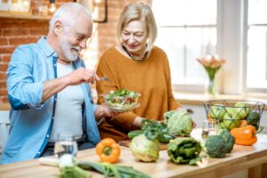 A senior couple eating a healthy salad