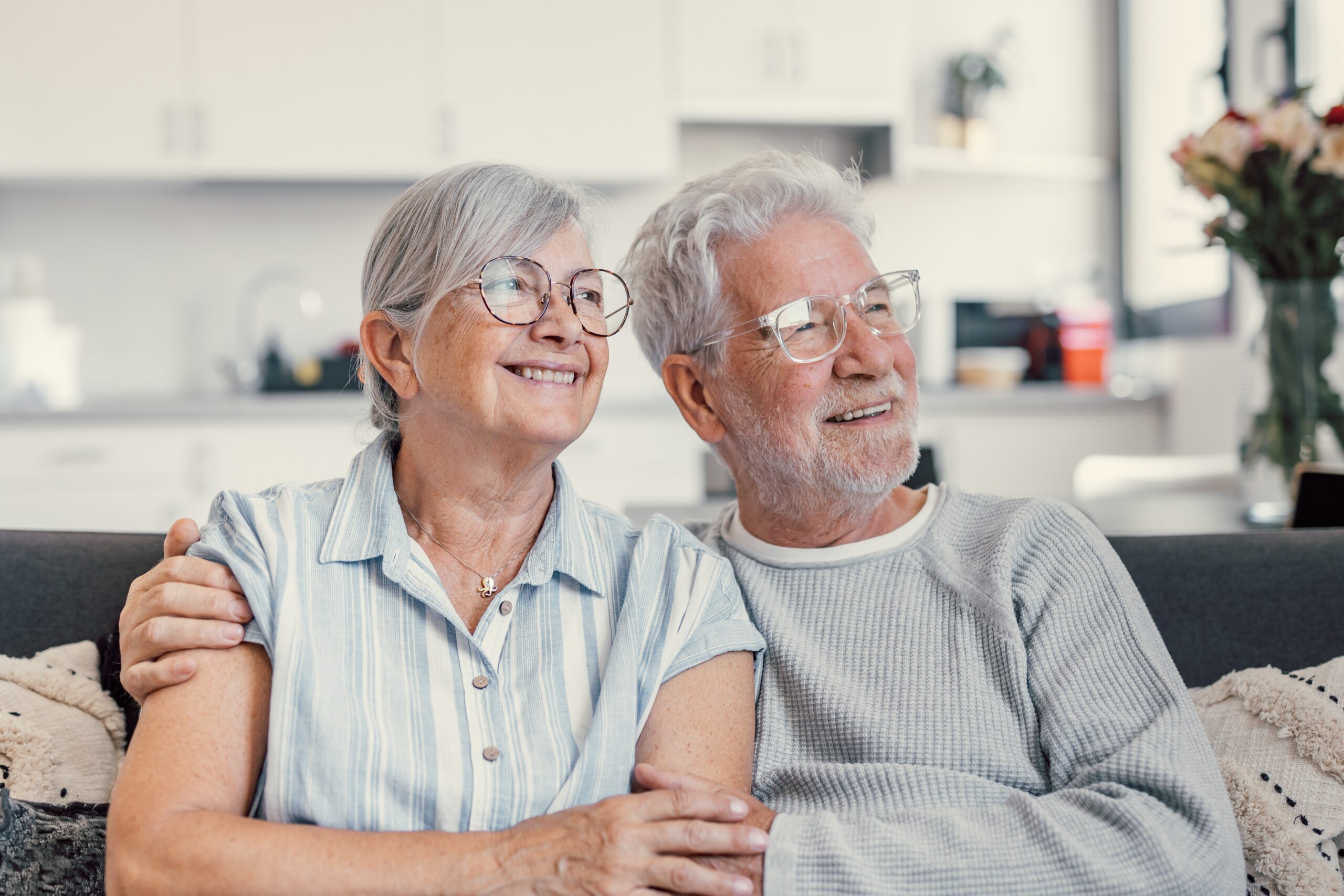 Senior couple sitting together smiling